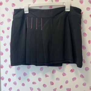 Athleta Black Tennis Skirt with Pink Stitching. Size L. Lined with Mesh Shorts